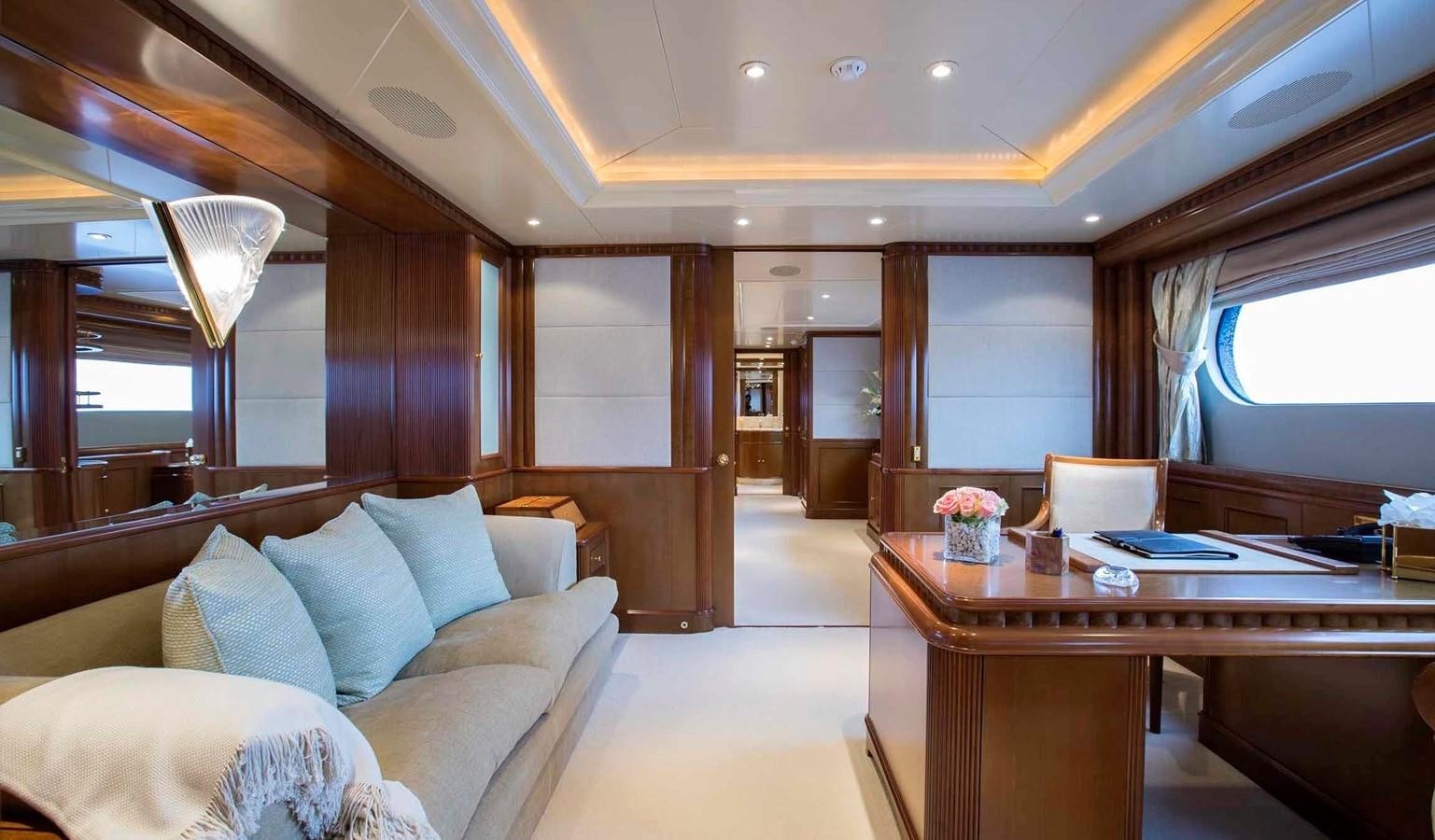 a room with a couch and a table aboard COME PRIMA Yacht for Charter