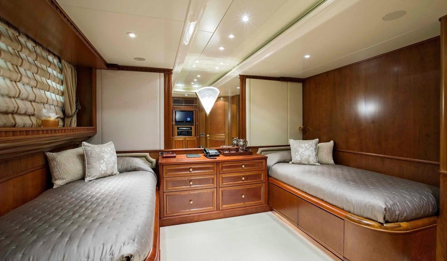 a room with a bed and a couch aboard COME PRIMA Yacht for Charter