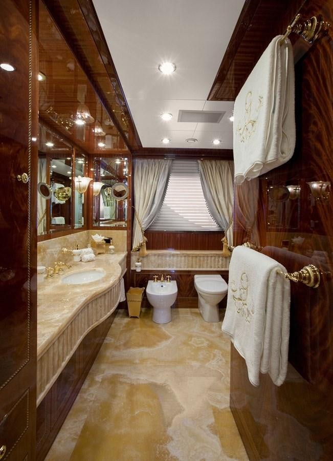 a bathroom with a large mirror aboard KADIMO'S Yacht for Sale