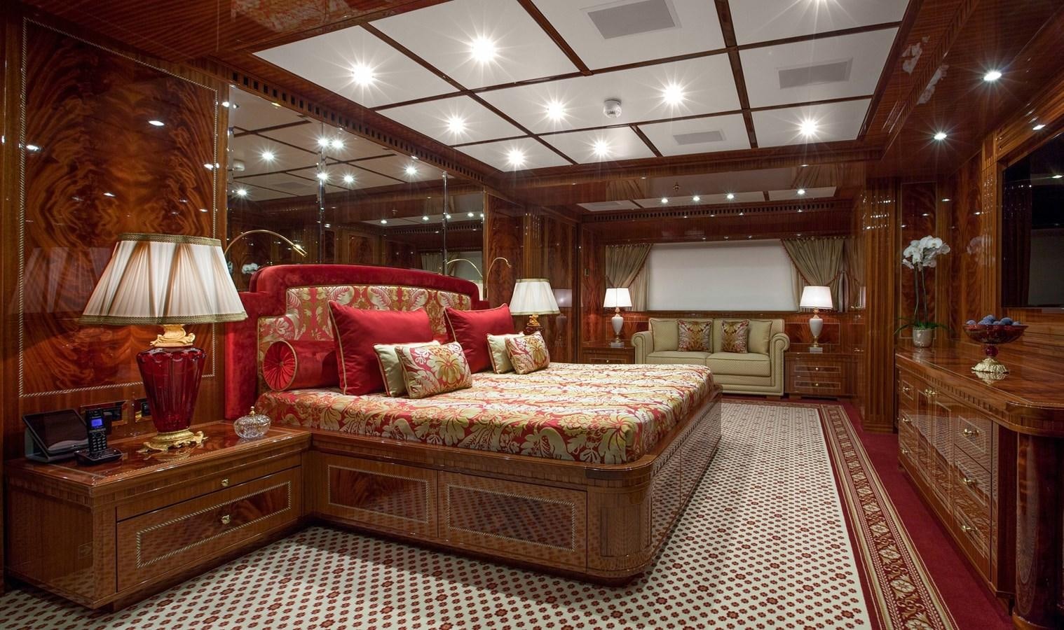 a large bedroom with a large bed aboard KADIMO'S Yacht for Sale