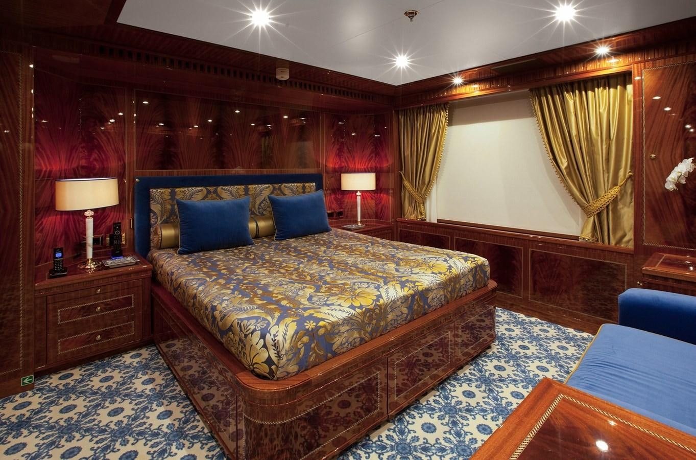 a large bedroom with a bed aboard KADIMO'S Yacht for Sale