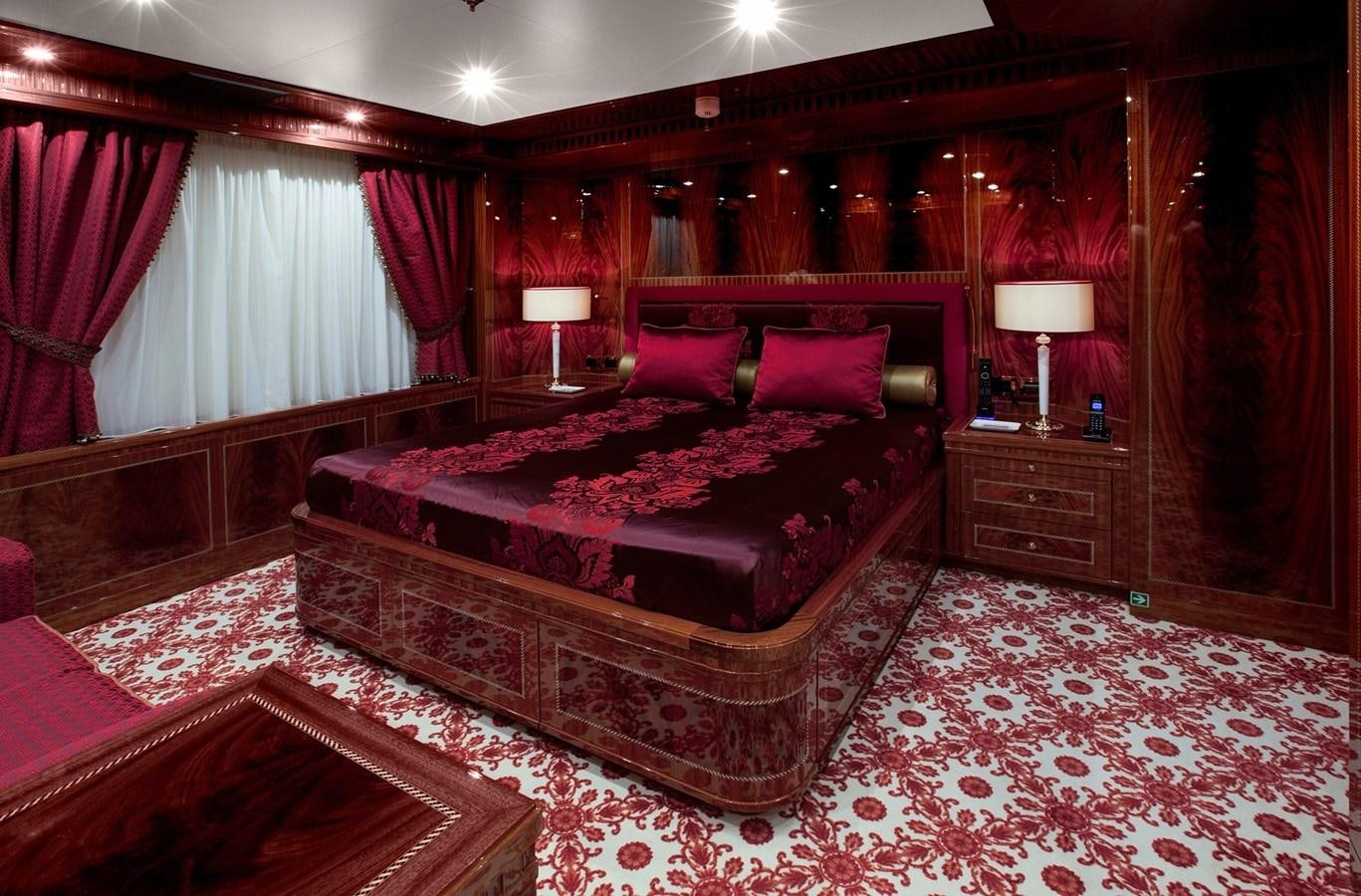 a large bed in a room aboard KADIMO'S Yacht for Sale