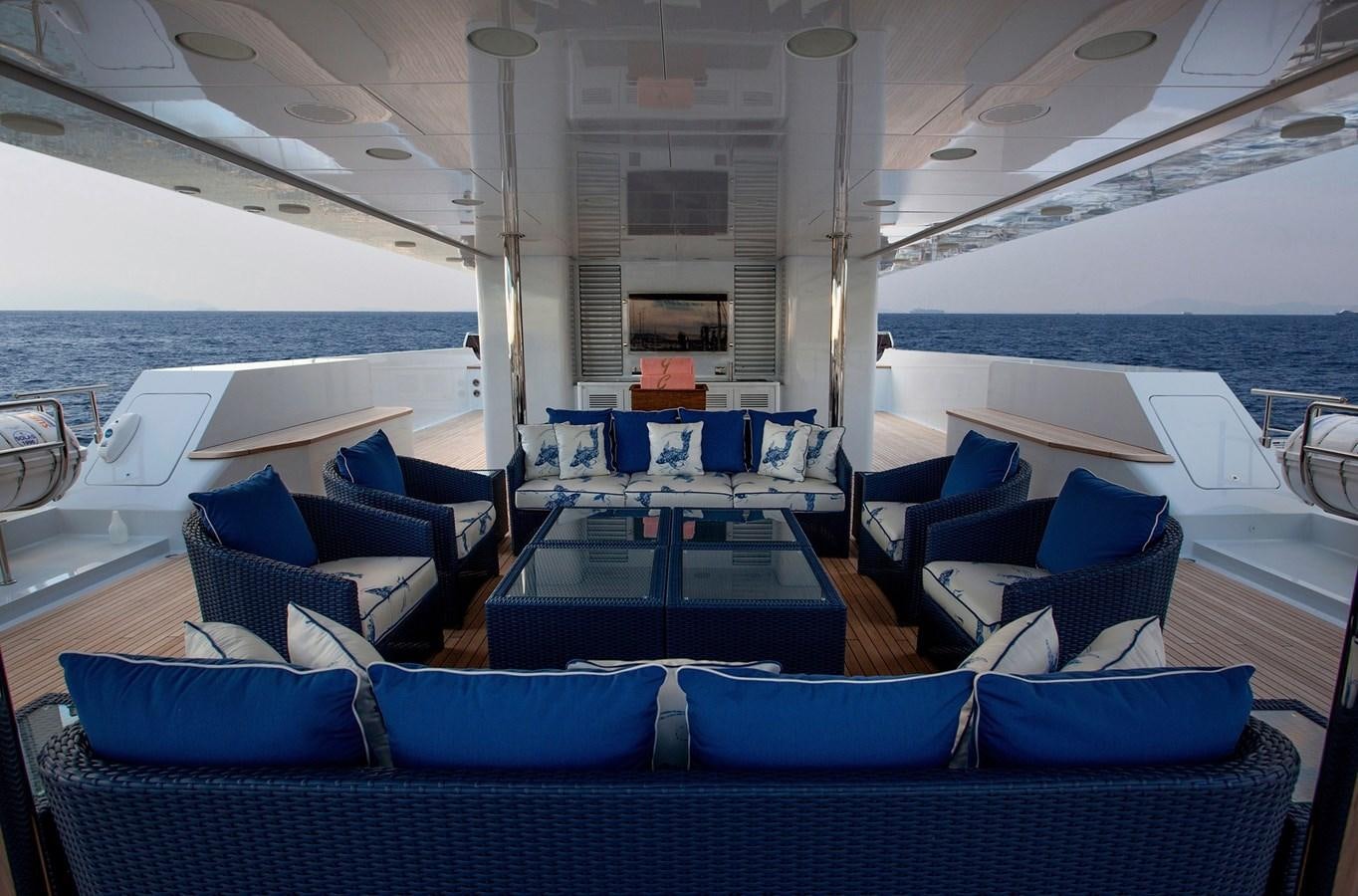 a boat with blue seats aboard KADIMO'S Yacht for Sale