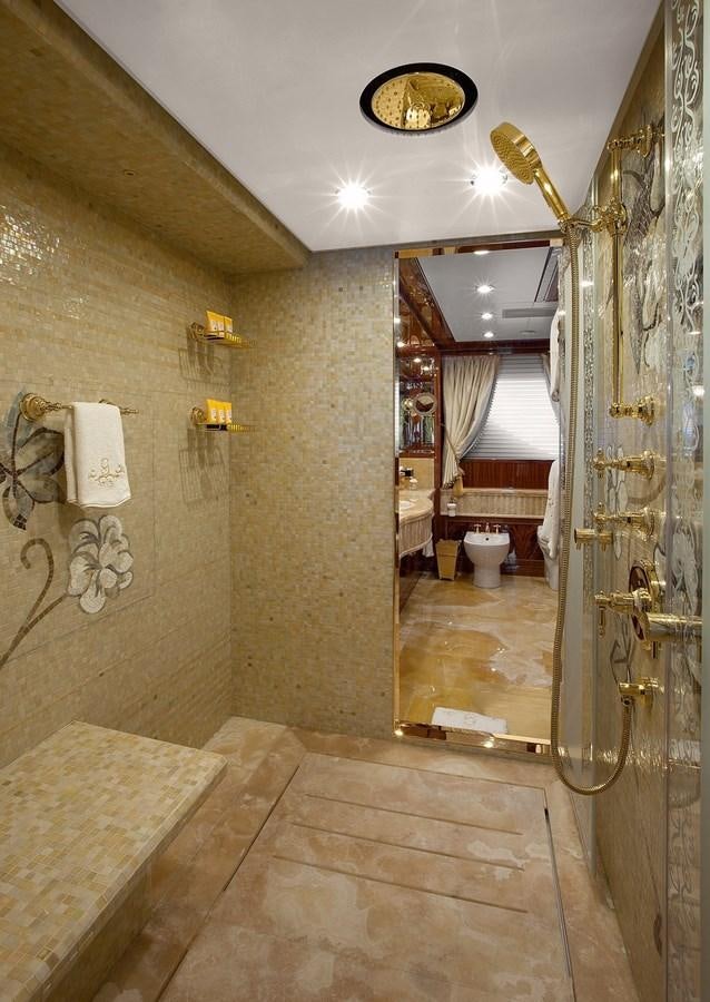 a bathroom with a toilet and a mirror aboard KADIMO'S Yacht for Sale