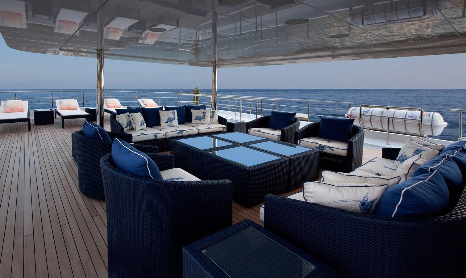 a deck with a large deck overlooking the ocean aboard KADIMO'S Yacht for Sale