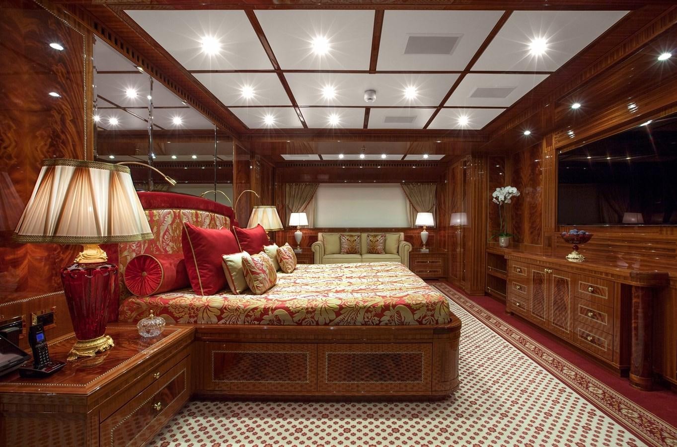 a large bedroom with a large bed aboard KADIMO'S Yacht for Sale