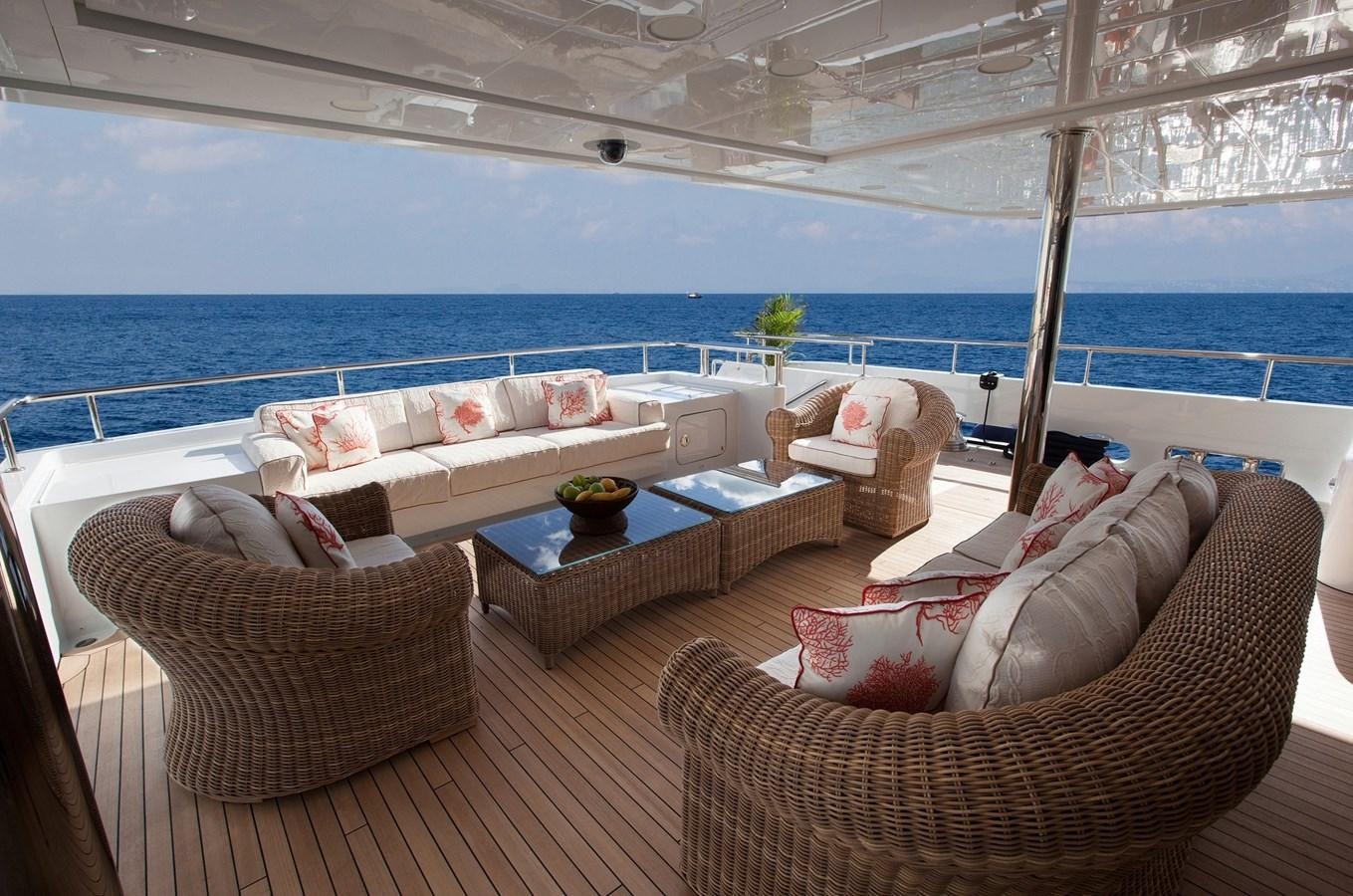 a room with a couch and a table and chairs aboard KADIMO'S Yacht for Sale