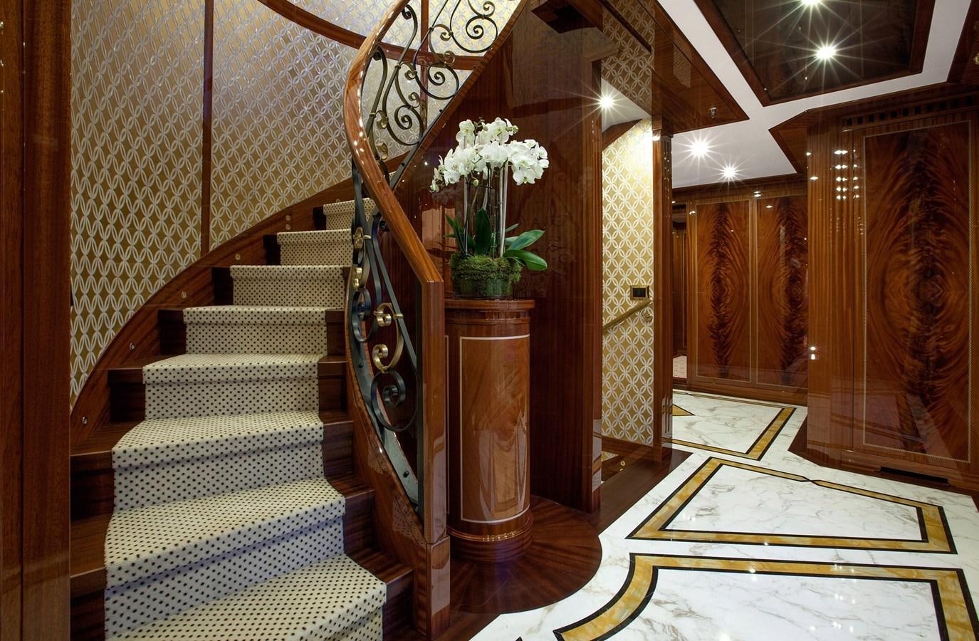 a staircase with a flower on the side aboard KADIMO'S Yacht for Sale