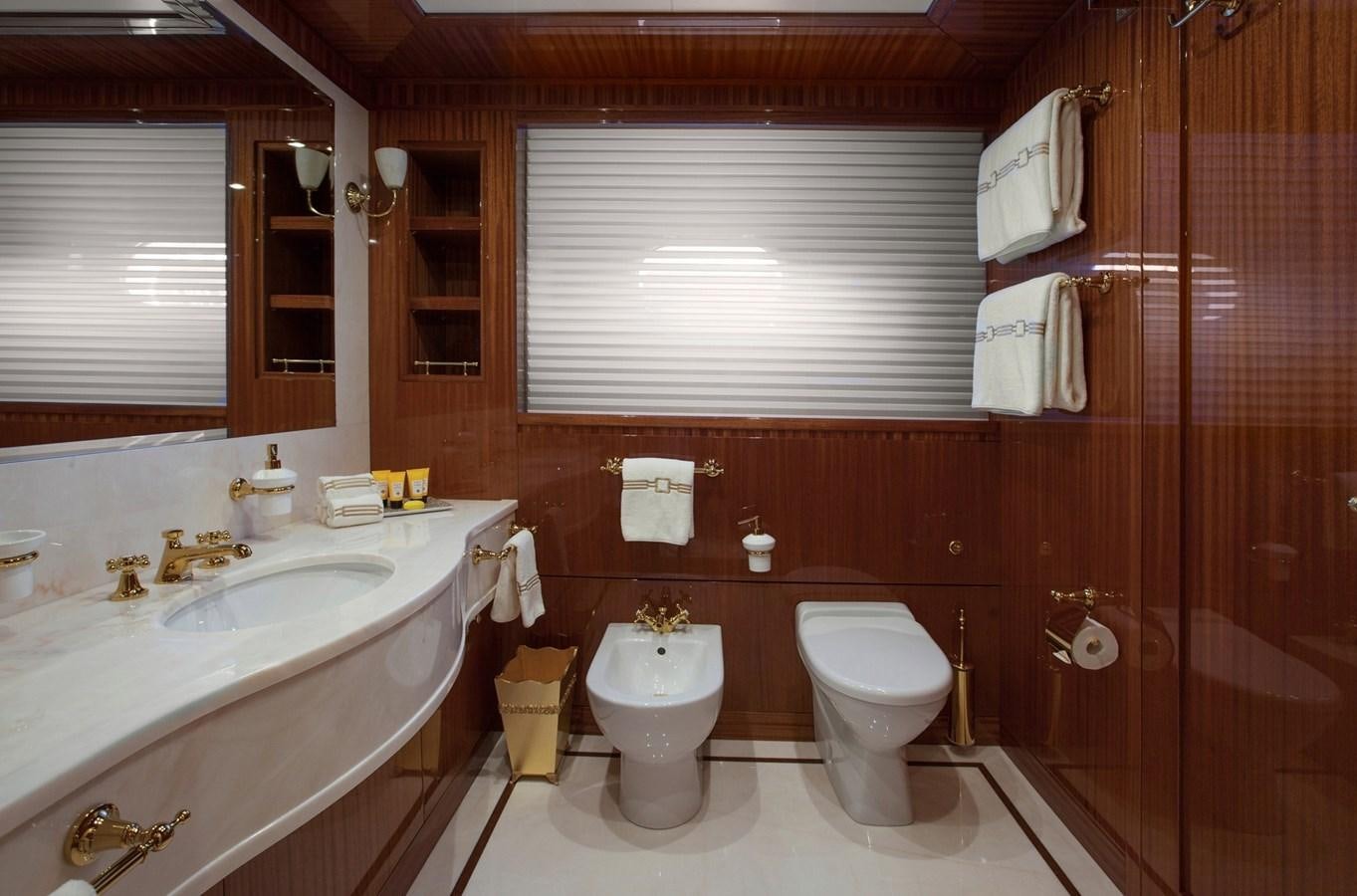 a bathroom with a toilet sink and a bathtub aboard KADIMO'S Yacht for Sale