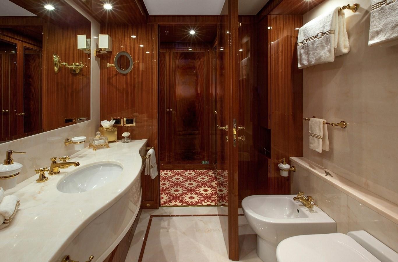 a bathroom with a sink and a bathtub aboard KADIMO'S Yacht for Sale