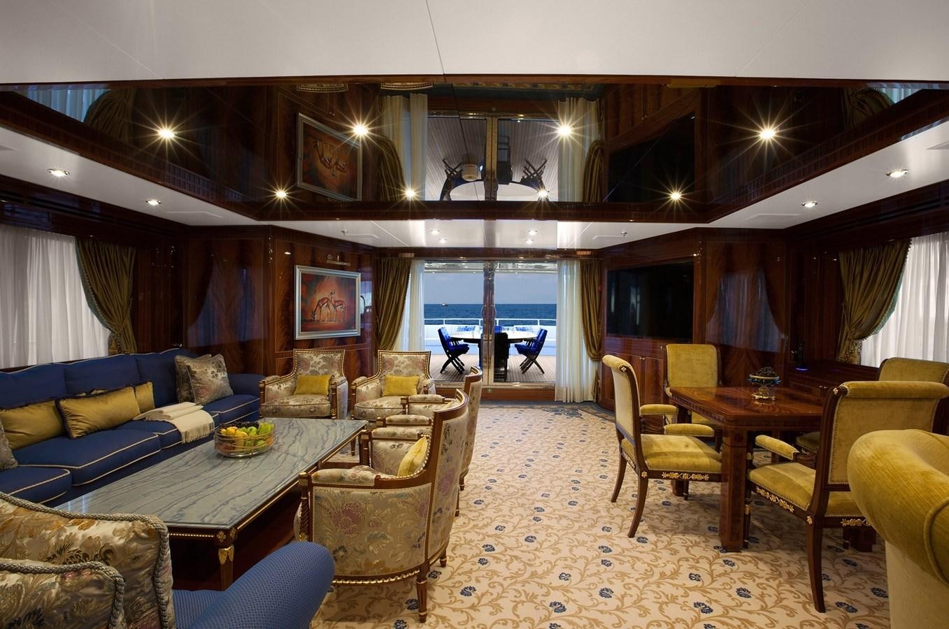 a living room with a large window aboard KADIMO'S Yacht for Sale
