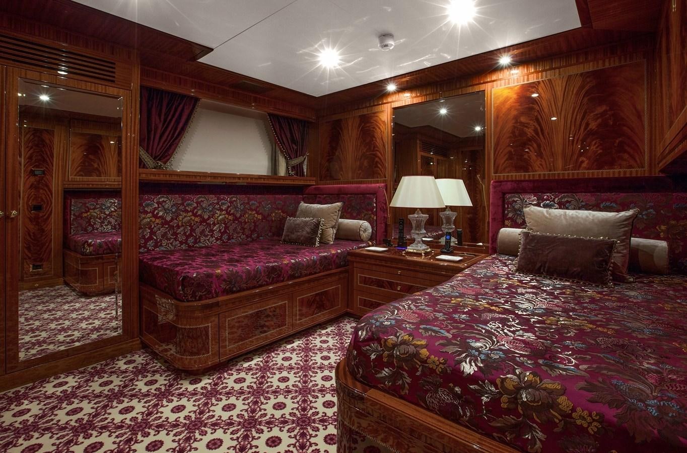 a couple of beds in a hotel room aboard KADIMO'S Yacht for Sale