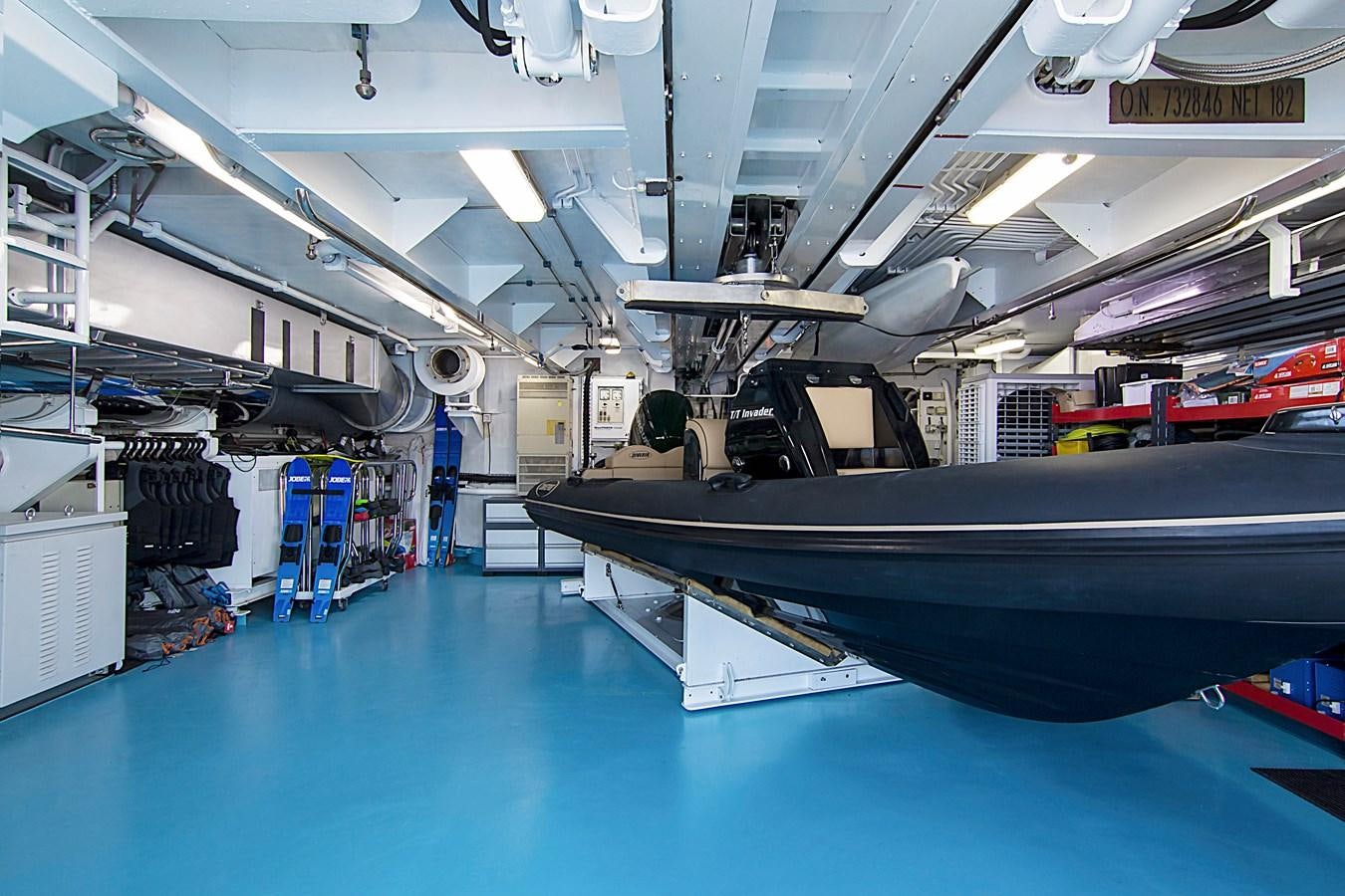 a large blue and black tank in a warehouse aboard INVADER Yacht for Sale