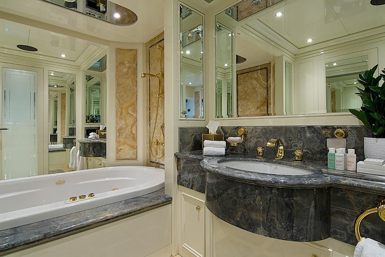 a bathroom with a marble counter top aboard INVADER Yacht for Sale