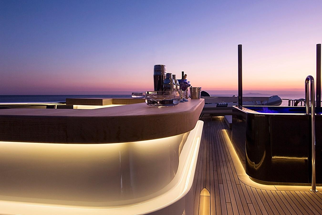 a large white boat on a dock aboard INVADER Yacht for Sale