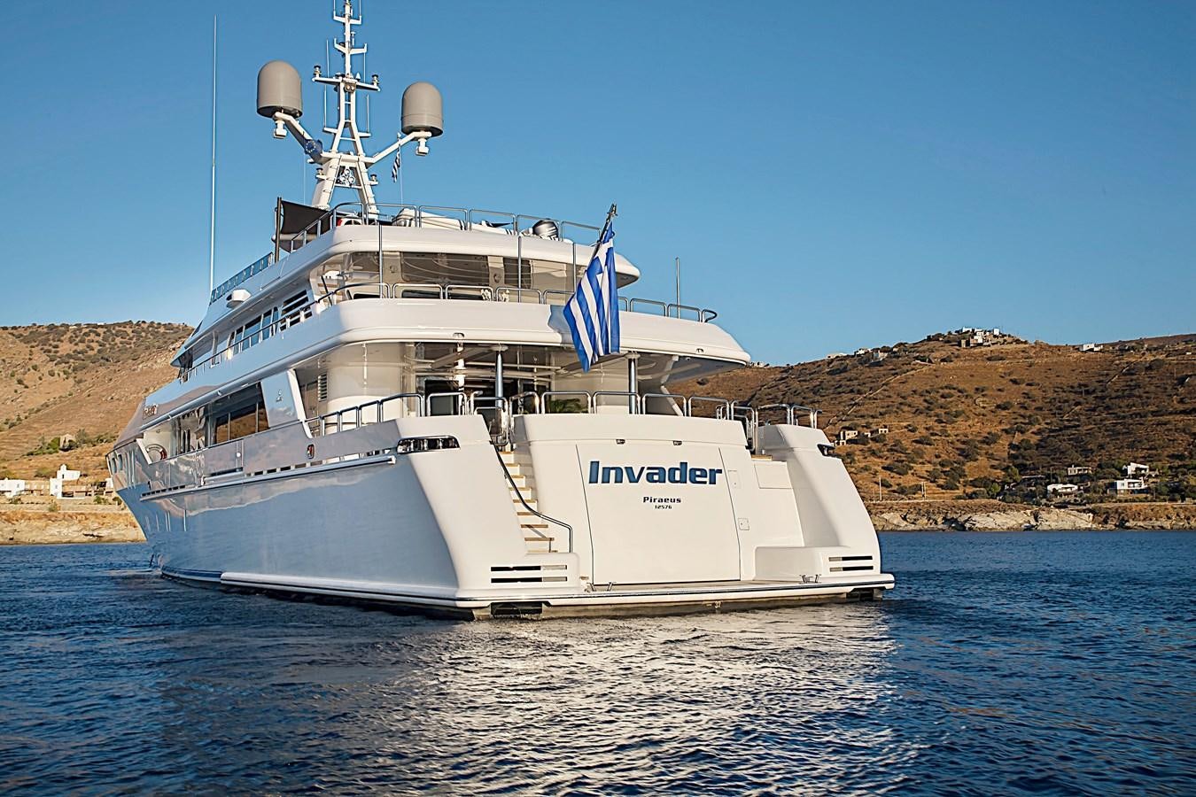 a large white boat on the water aboard INVADER Yacht for Sale