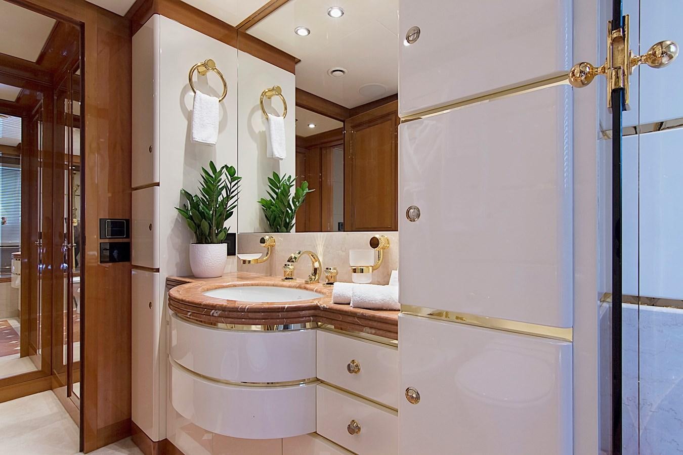 a bathroom with a sink and a mirror aboard INVADER Yacht for Sale