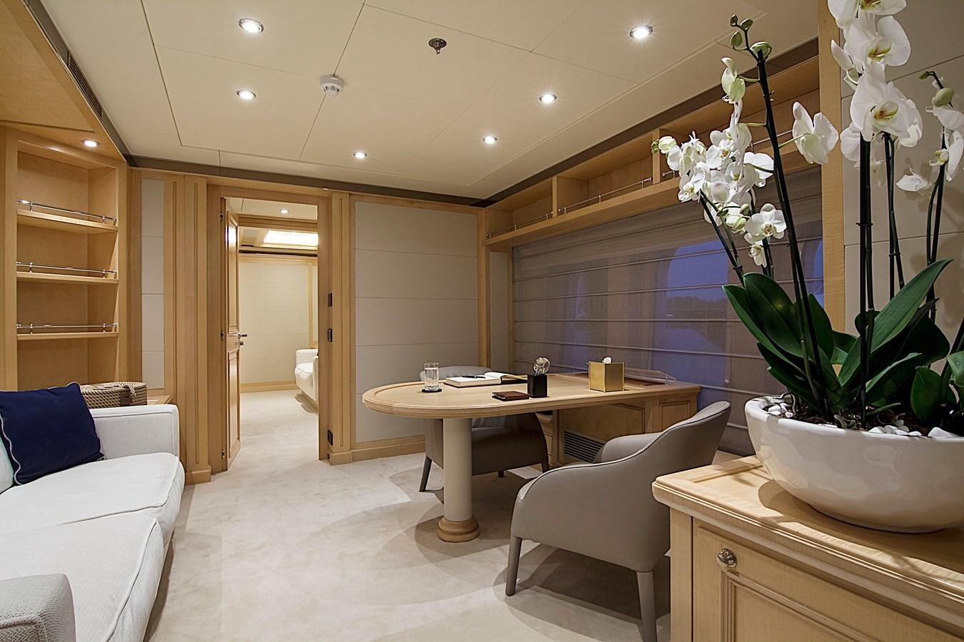 a room with a table and chairs aboard INVADER Yacht for Sale