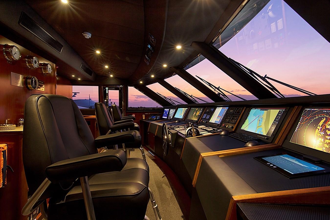 inside of a vehicle with many screens aboard INVADER Yacht for Sale