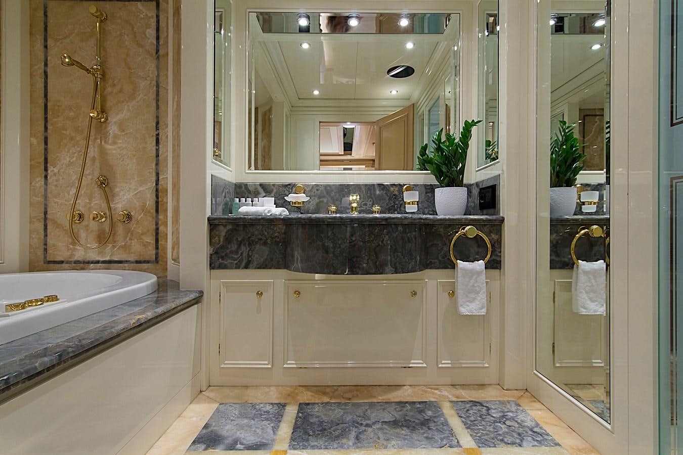 a bathroom with a large mirror aboard INVADER Yacht for Sale