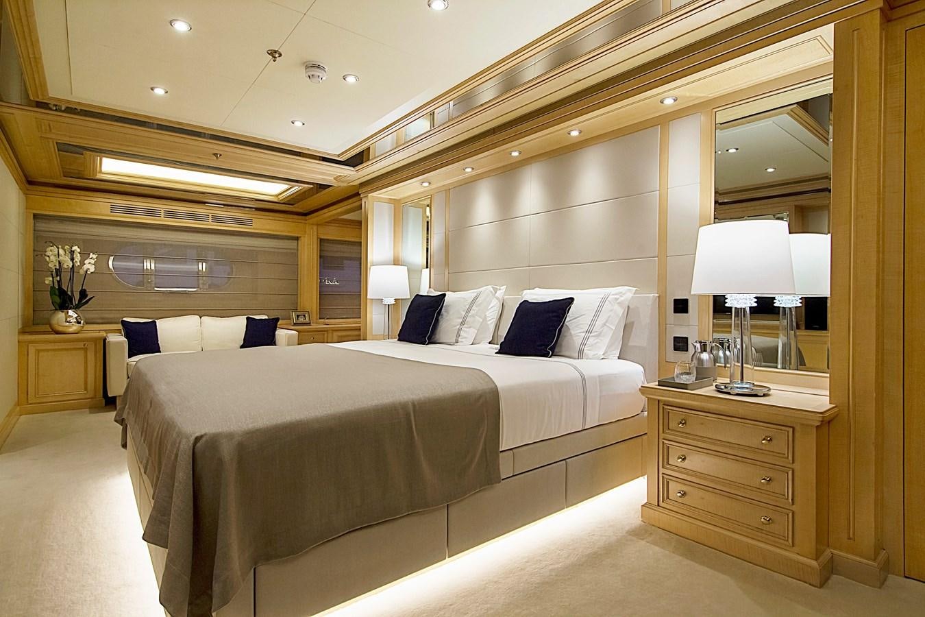 a room with a bed and a desk aboard INVADER Yacht for Sale