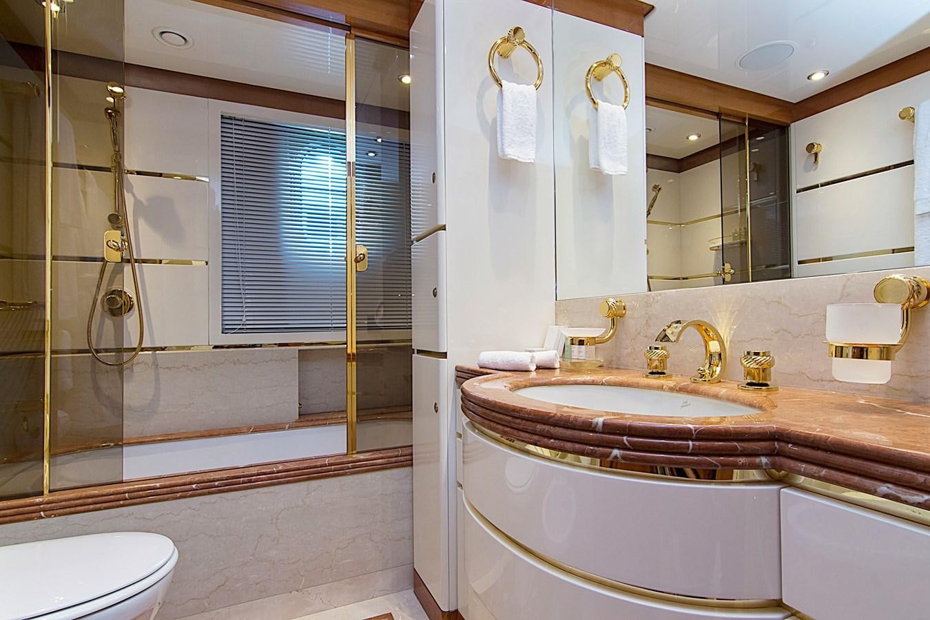a bathroom with a sink and a shower aboard INVADER Yacht for Sale