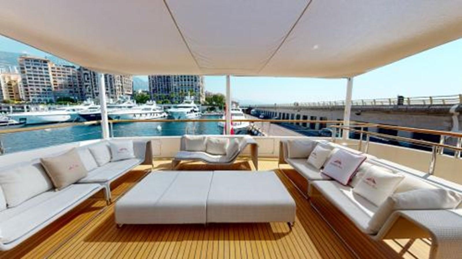 a room with a couch and a large body of water aboard LA PELLEGRINA 1 Yacht for Sale