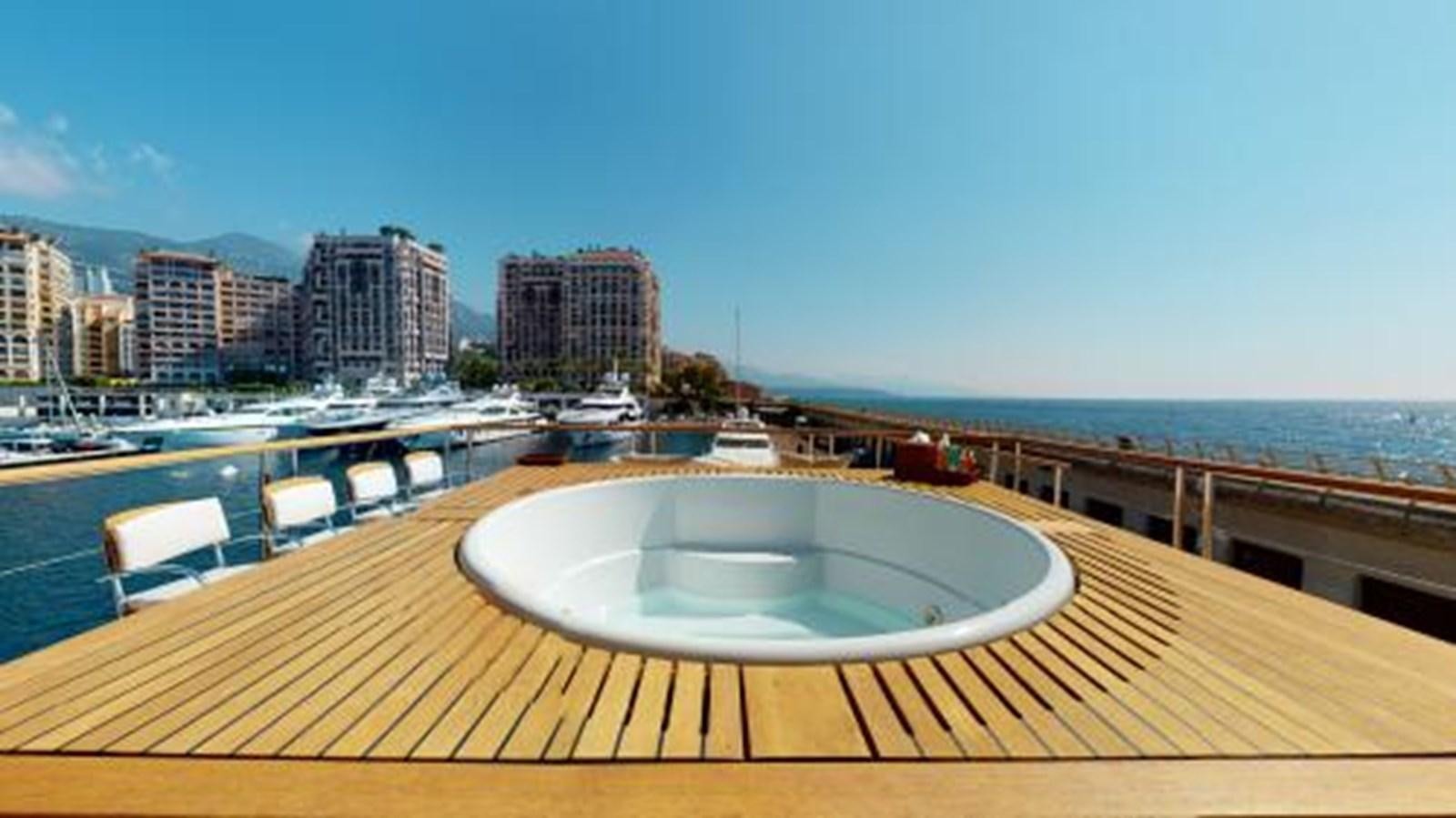 a large pool with a city in the background aboard LA PELLEGRINA 1 Yacht for Sale