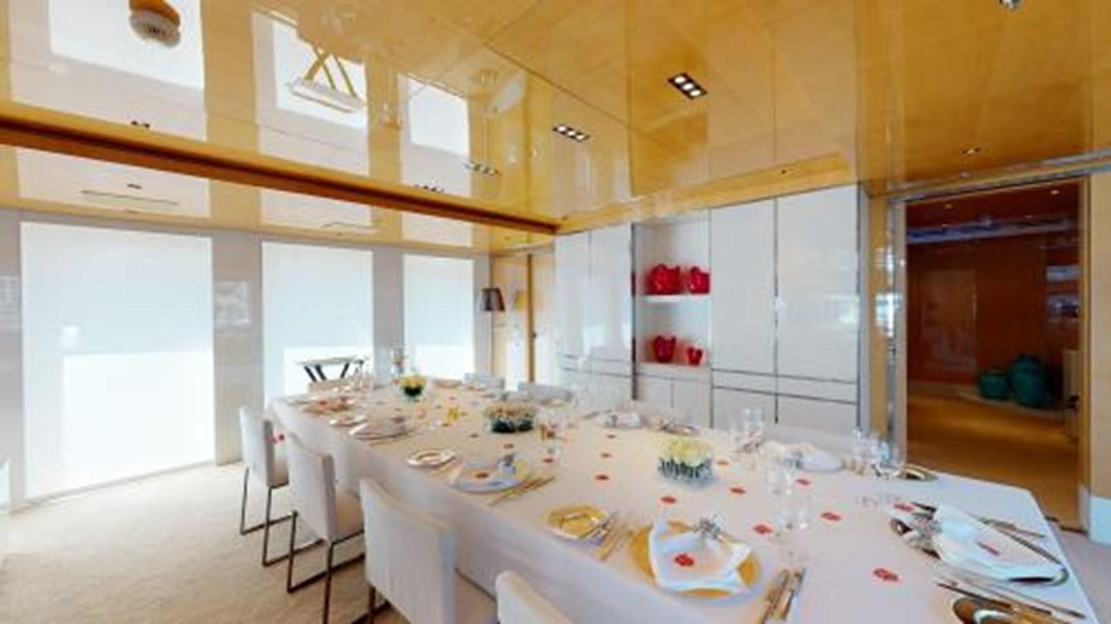 a dining table in a room aboard LA PELLEGRINA 1 Yacht for Sale