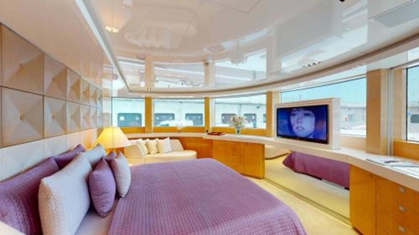 a large bedroom with a purple bed aboard LA PELLEGRINA 1 Yacht for Sale