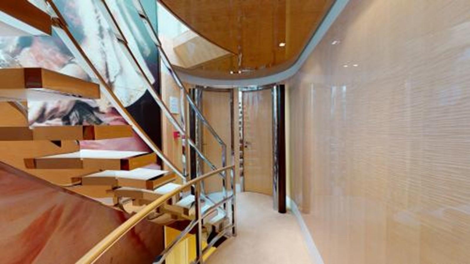 a room with a staircase and a staircase aboard LA PELLEGRINA 1 Yacht for Sale