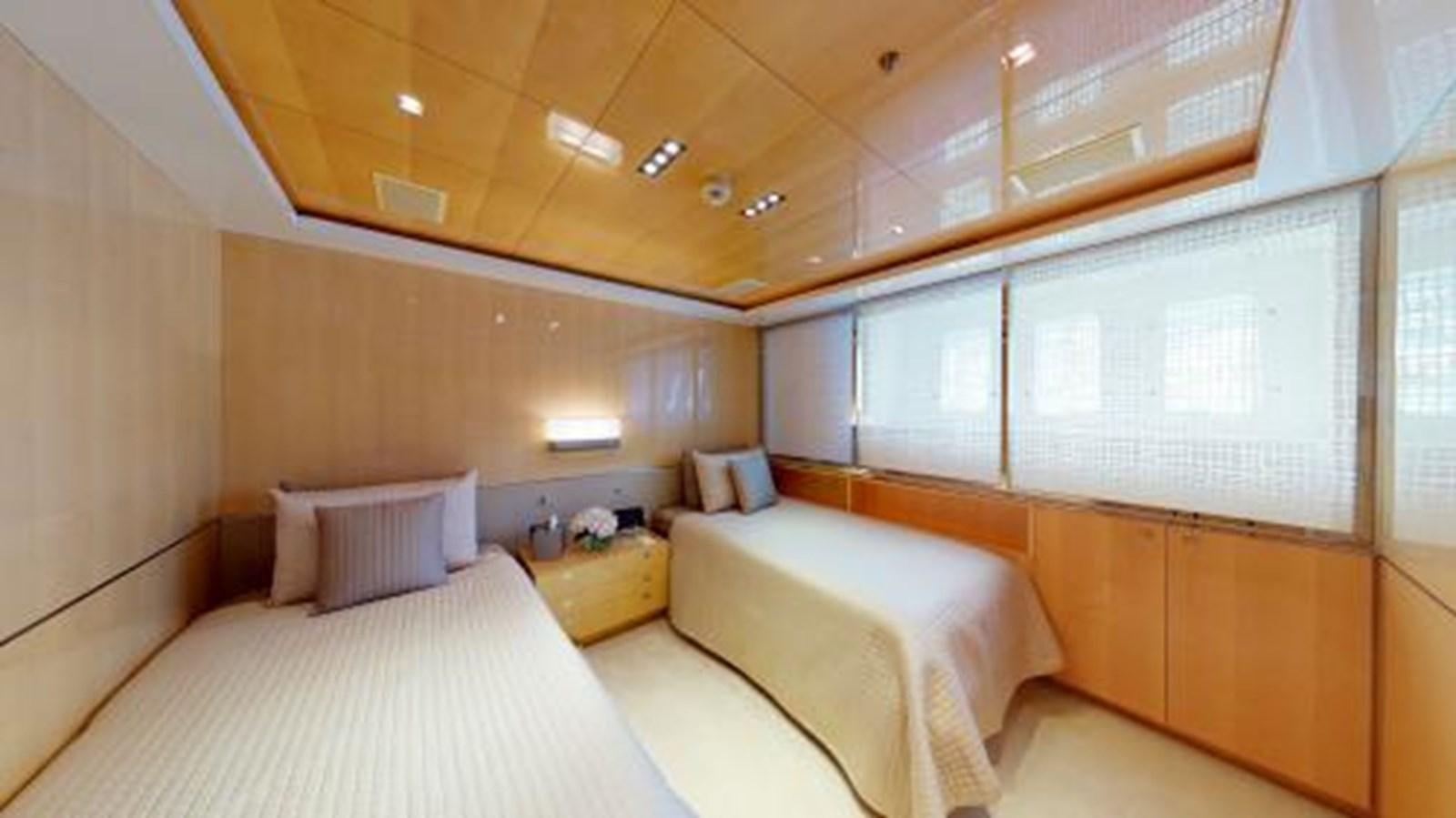 a room with a couple of beds aboard LA PELLEGRINA 1 Yacht for Sale