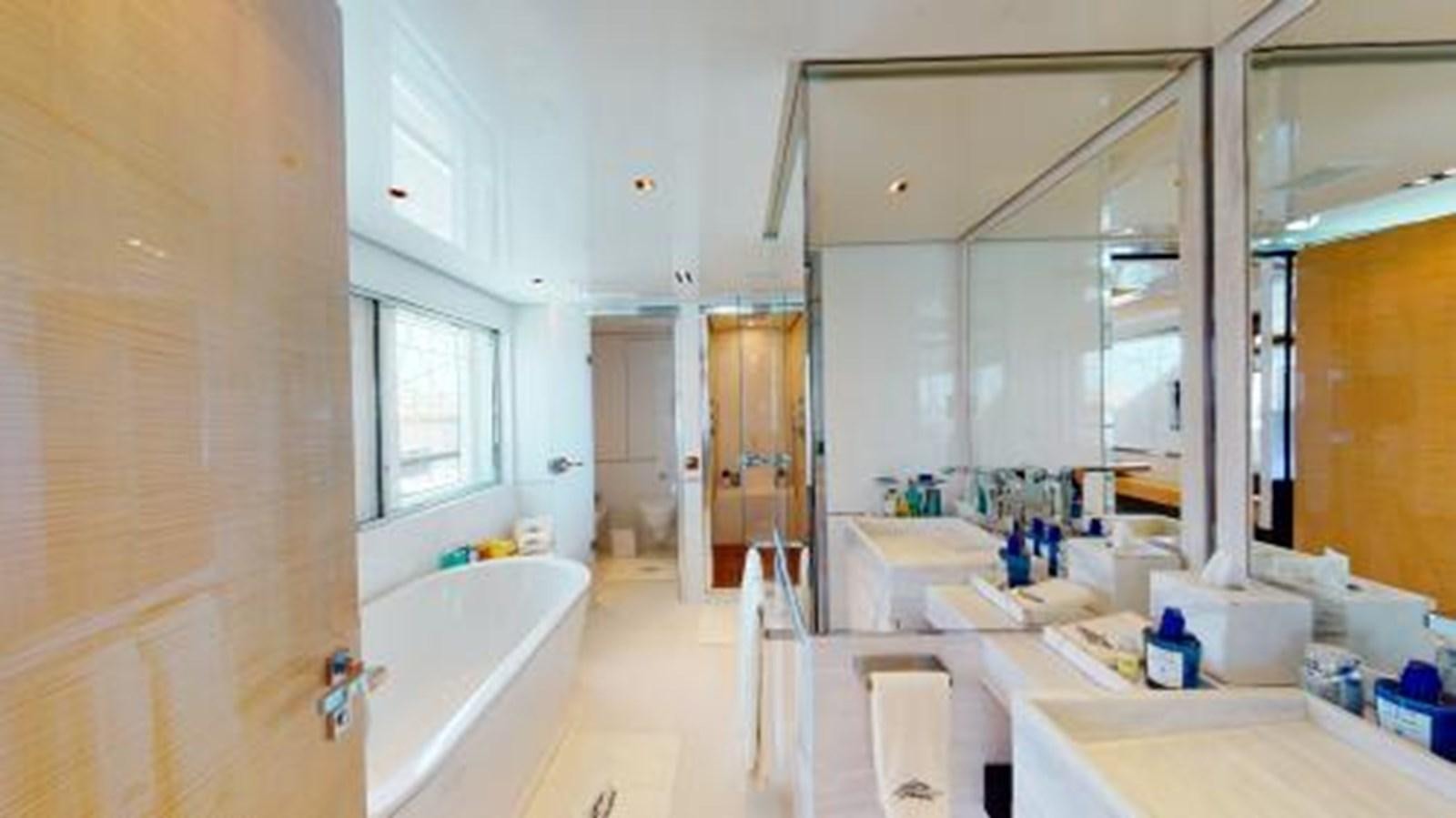 a bathroom with a tub sink and cabinets aboard LA PELLEGRINA 1 Yacht for Sale