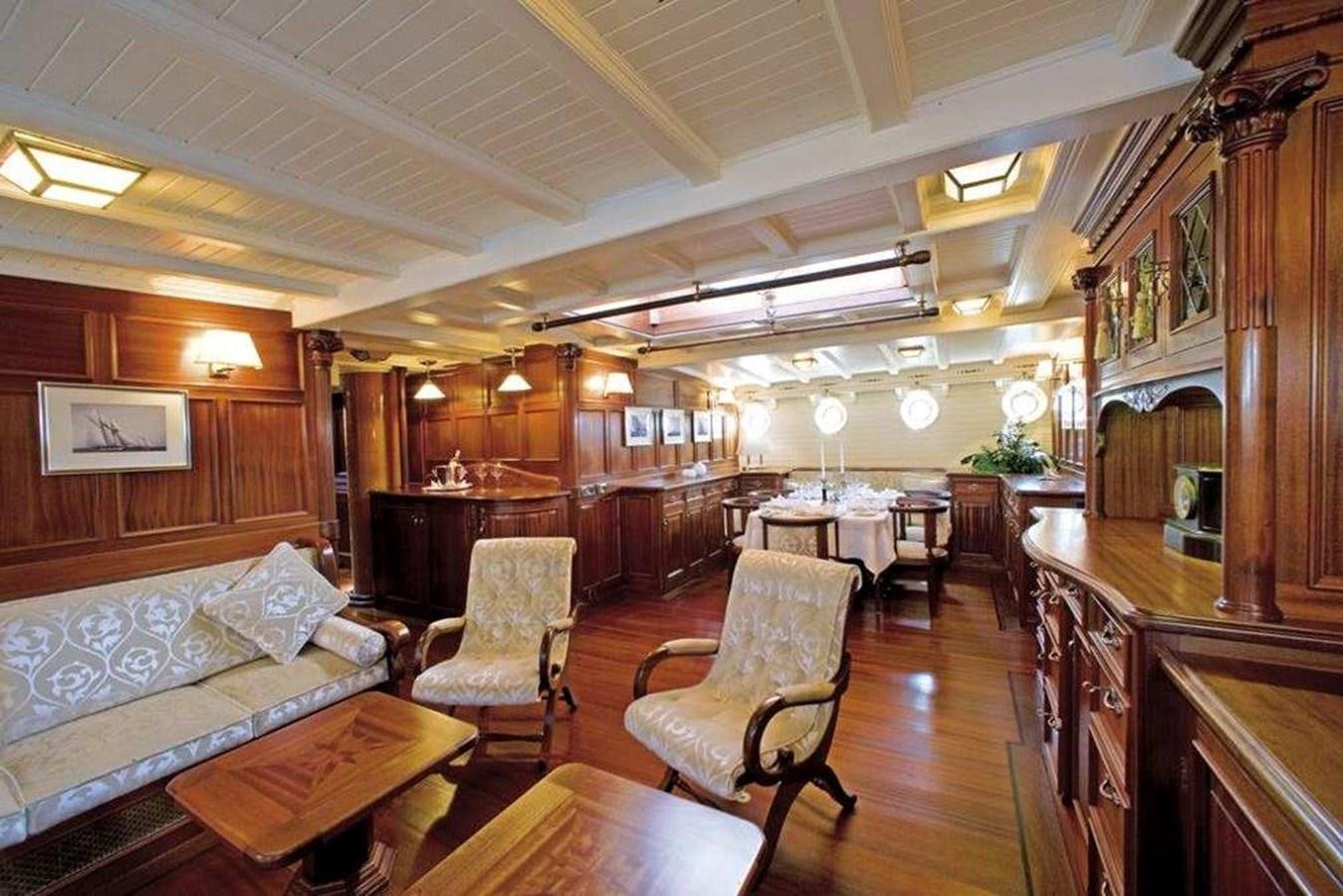 a large living room with wood floors aboard ELEONORA Yacht for Sale