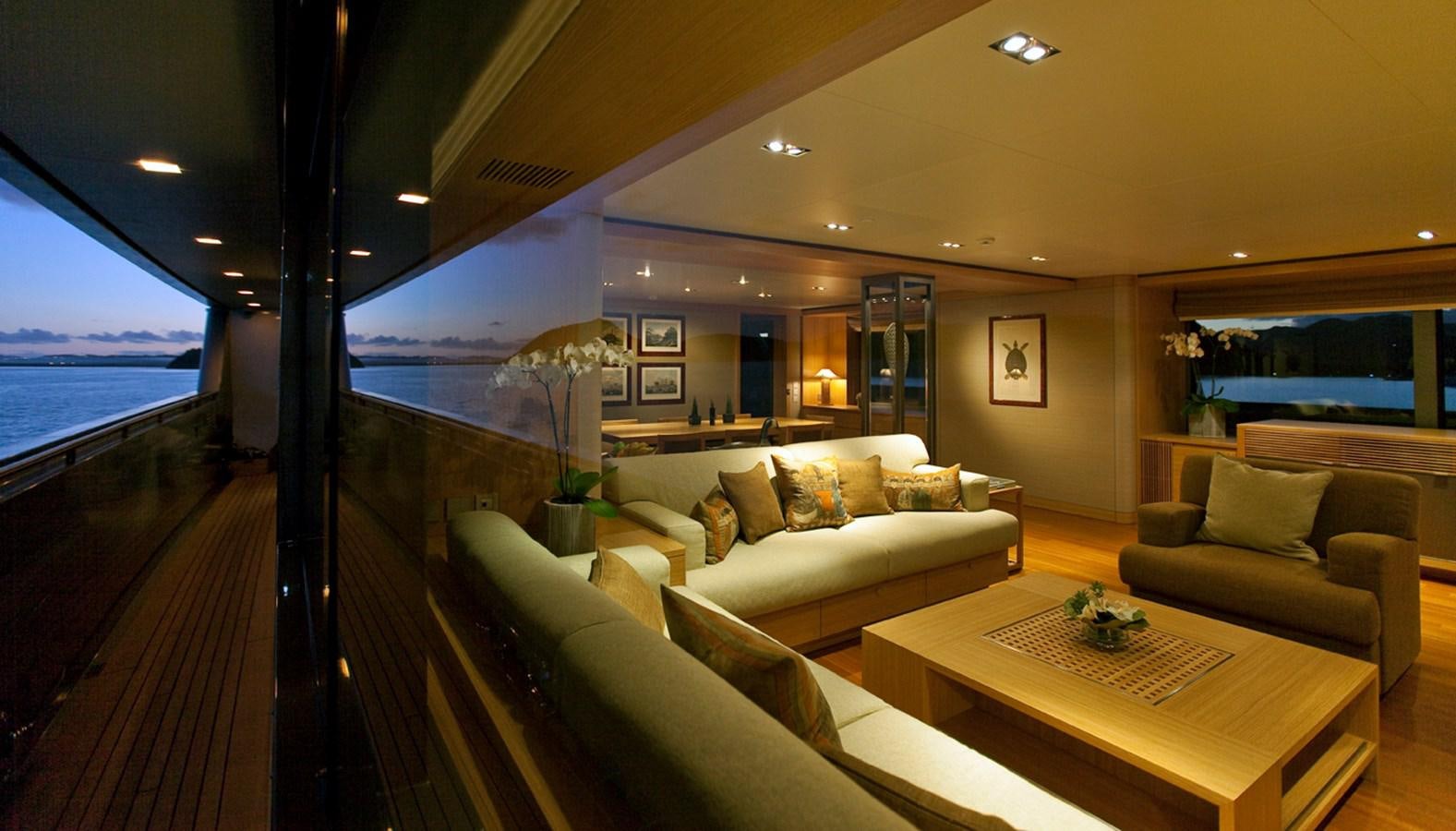 a living room with a wood floor aboard FALCO MOSCATA Yacht for Sale