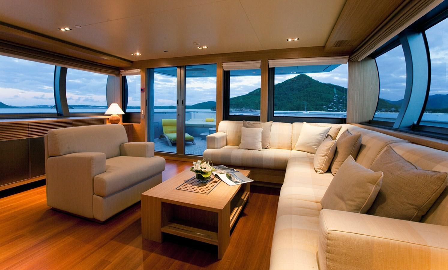 a living room with a large window aboard FALCO MOSCATA Yacht for Sale