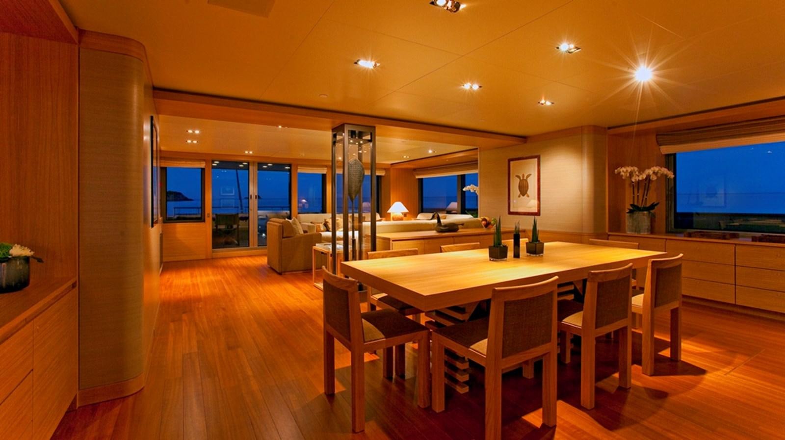 a large kitchen with a table and chairs aboard FALCO MOSCATA Yacht for Sale