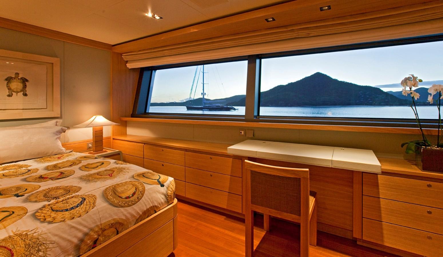 a room with a bed and a window aboard FALCO MOSCATA Yacht for Sale