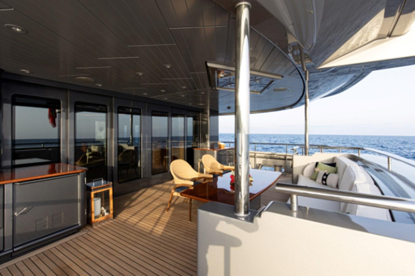 a room with a bed and a table aboard VIBRANCE Yacht for Sale