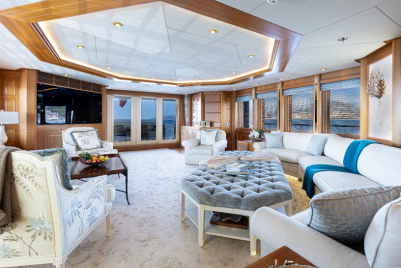 a large living room with a large open ceiling aboard VIBRANCE Yacht for Sale
