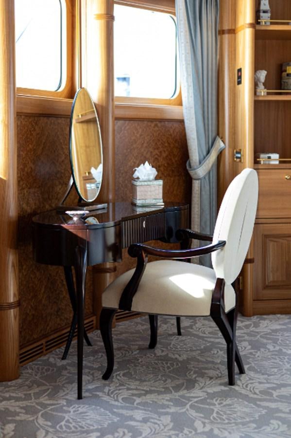 a chair in a room aboard VIBRANCE Yacht for Sale