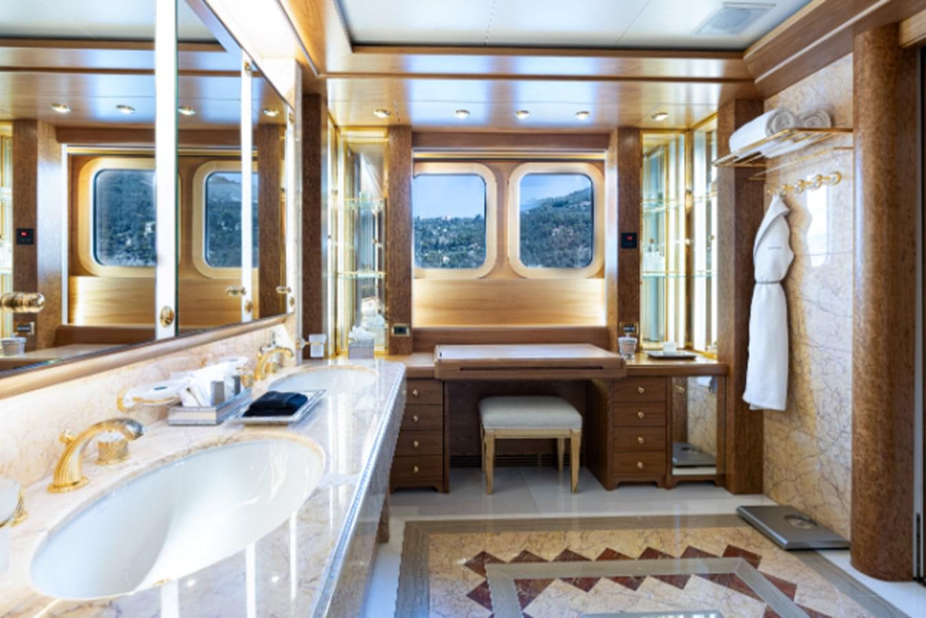 a bathroom with a tub sink and a sink aboard VIBRANCE Yacht for Sale