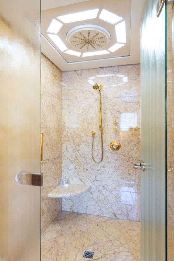 a bathroom with a large chandelier aboard VIBRANCE Yacht for Sale