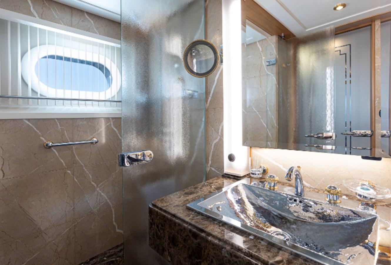 a bathroom with a sink and a mirror aboard VIBRANCE Yacht for Sale