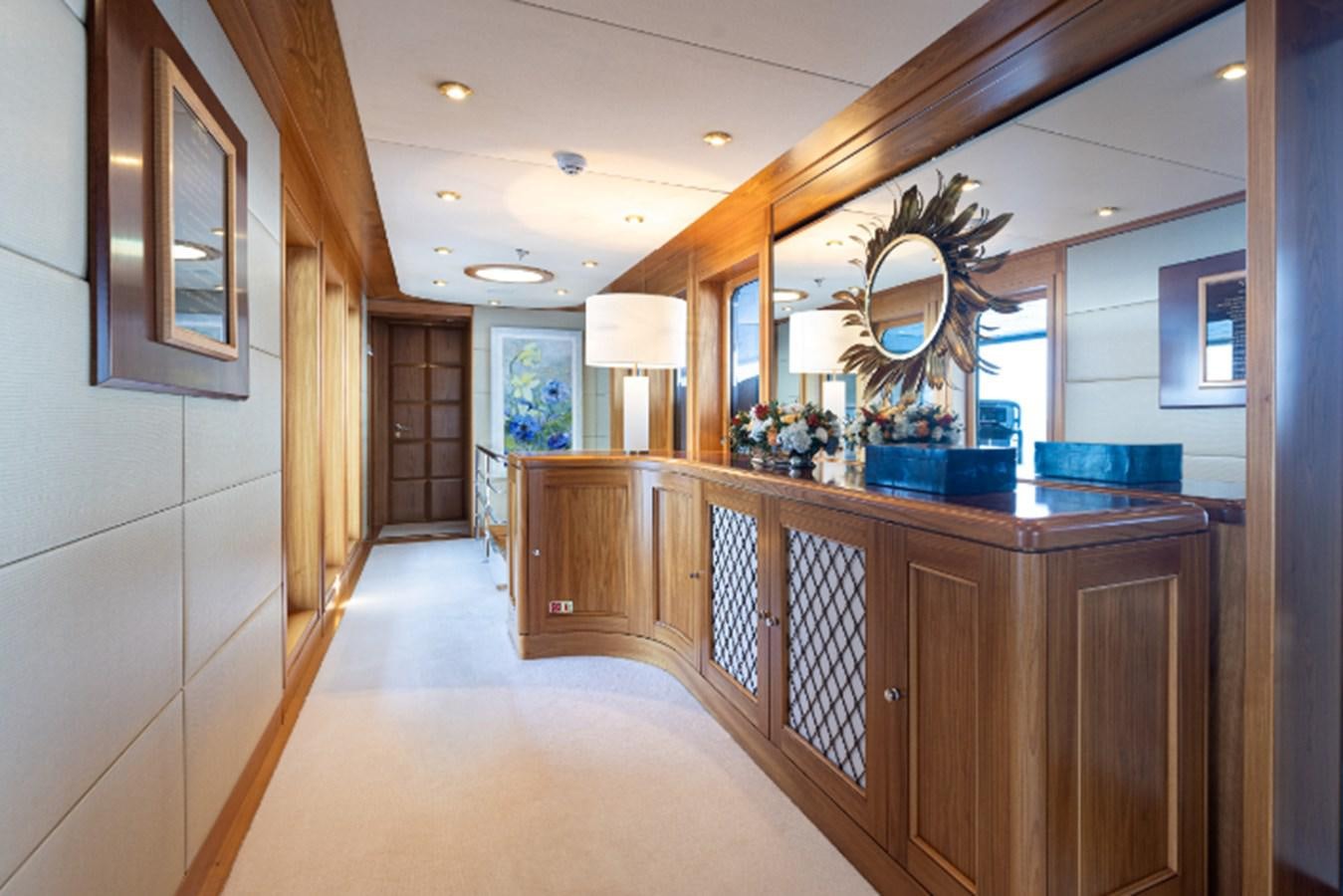 a large bathroom with a large mirror aboard VIBRANCE Yacht for Sale