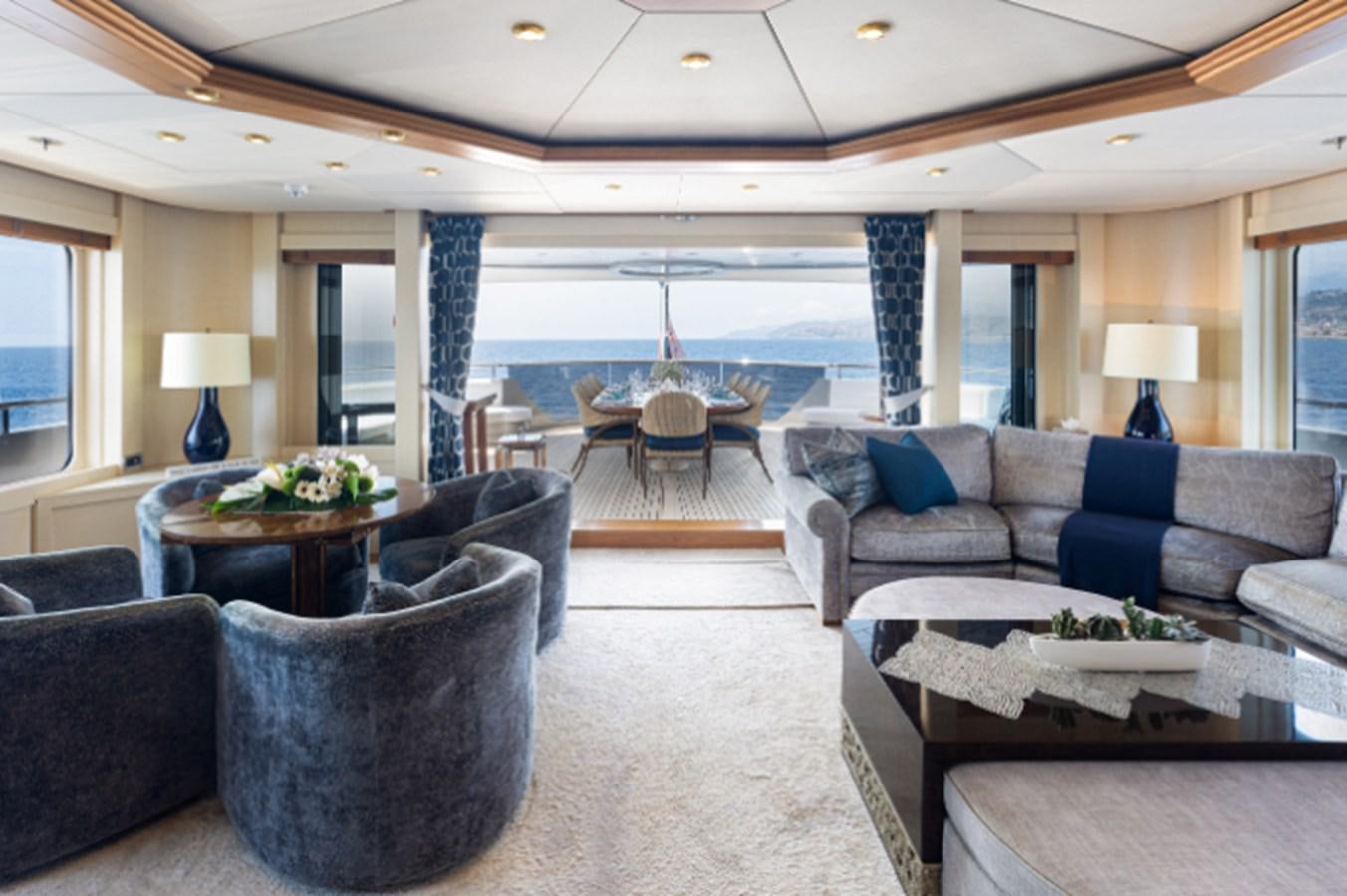 a living room with a large patio aboard VIBRANCE Yacht for Sale