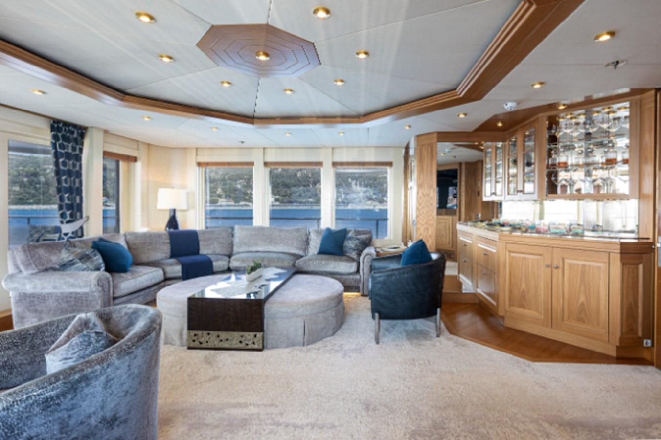 a living room with a large open window aboard VIBRANCE Yacht for Sale