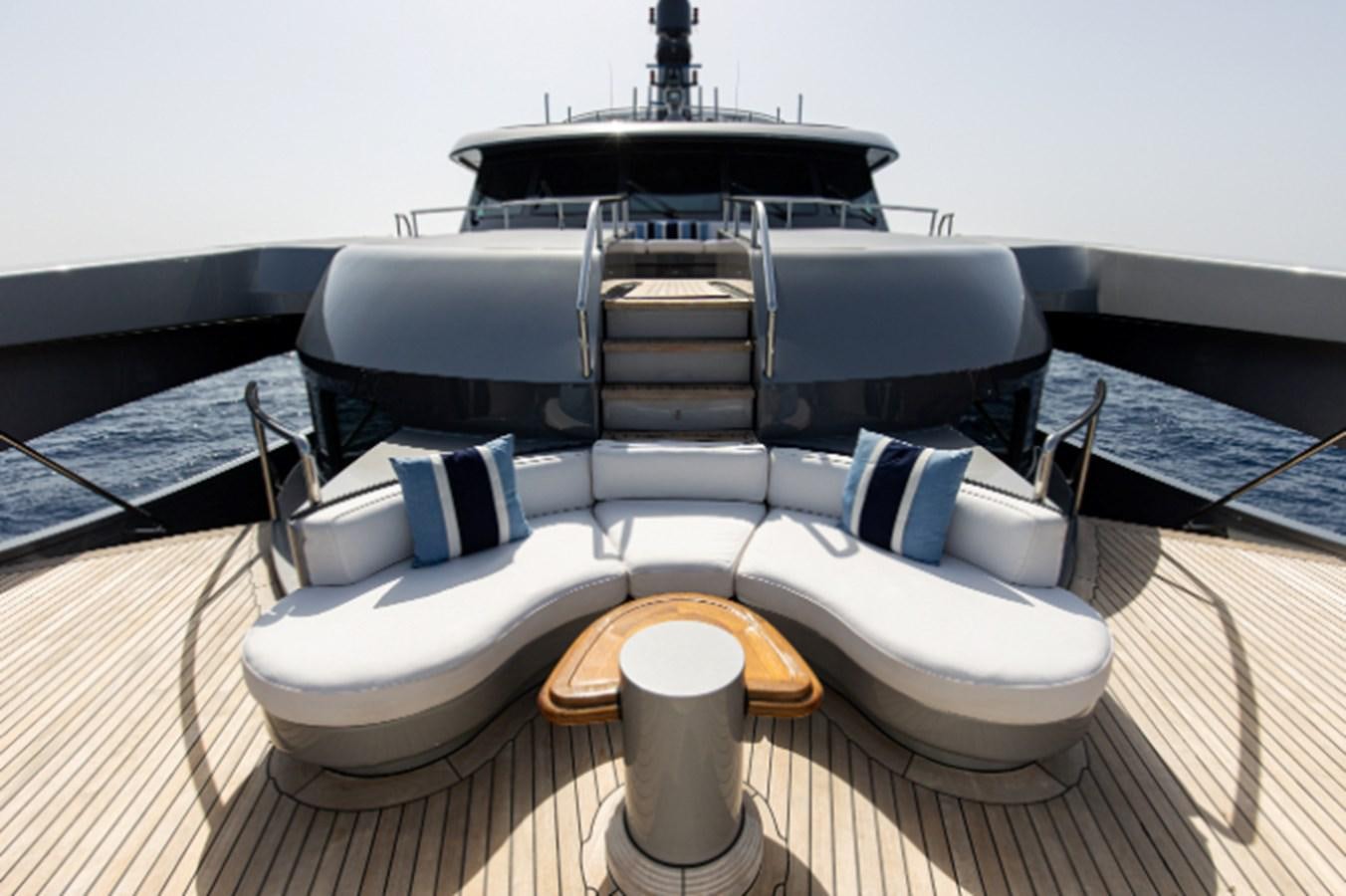 a white boat with a wooden steering wheel aboard VIBRANCE Yacht for Sale