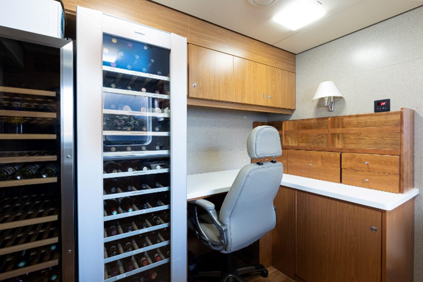 a room with a chair and a desk and a computer aboard VIBRANCE Yacht for Sale