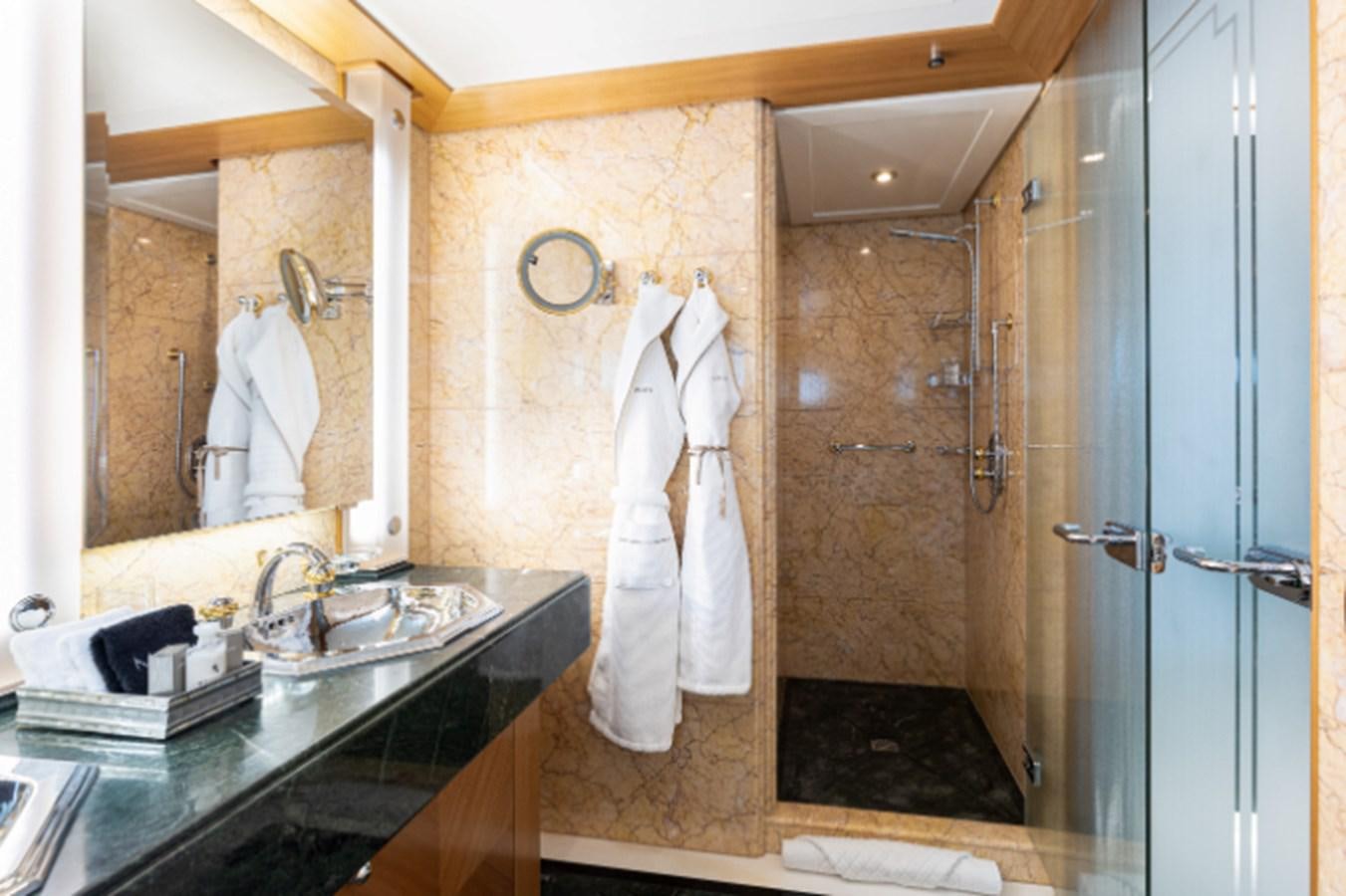 a bathroom with a large mirror aboard VIBRANCE Yacht for Sale